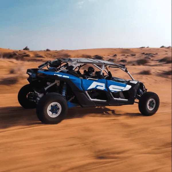 4-Seater Can-Am Dune Buggy 1 Hour – Dubai Desert Two riders in a 4-seater Can-Am dune buggy on Dubai desert dunes