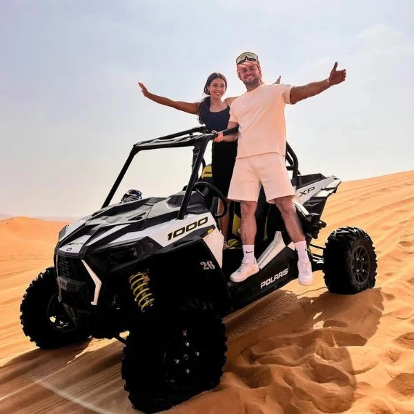 Polaris RZR 1000cc dune buggy on Dubai red sand dunes – entry-level family off-road vehicle