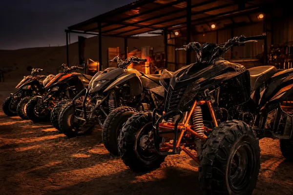 QUAD BIKE DUBAI PRICE GUIDE Lineup of quad bikes at Lahbab desert camp for the Dubai price guide